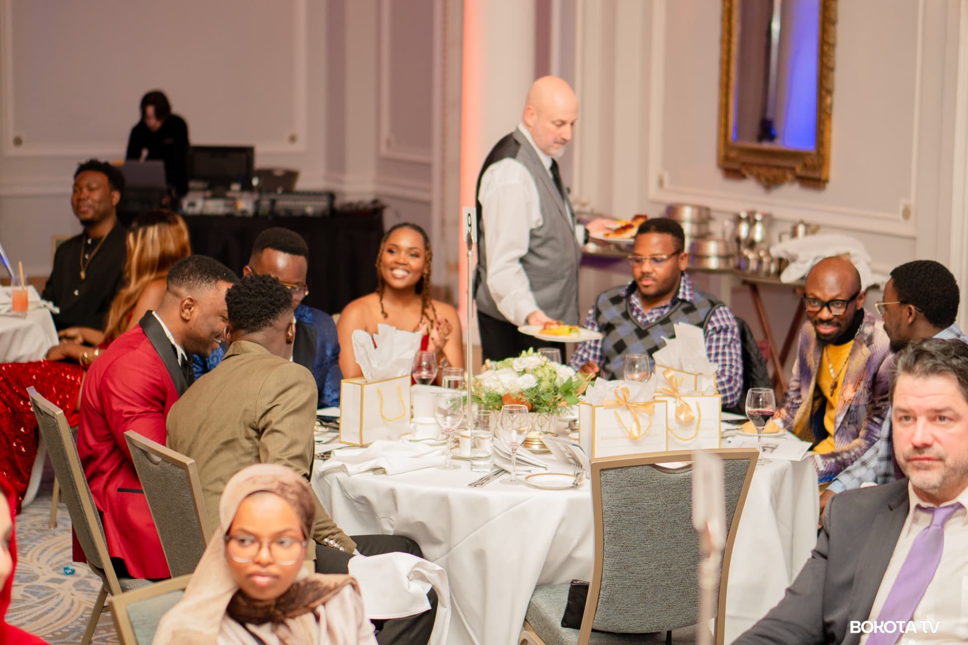 Dinner is served to guests at a table during the gala evening at the Fairmont Château Laurier