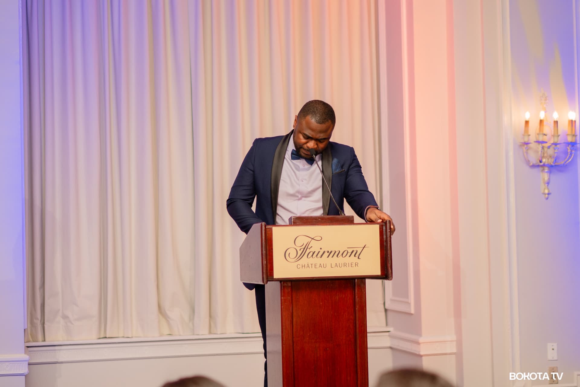 A speaker reads his remarks at the Fairmont Château Laurier podium