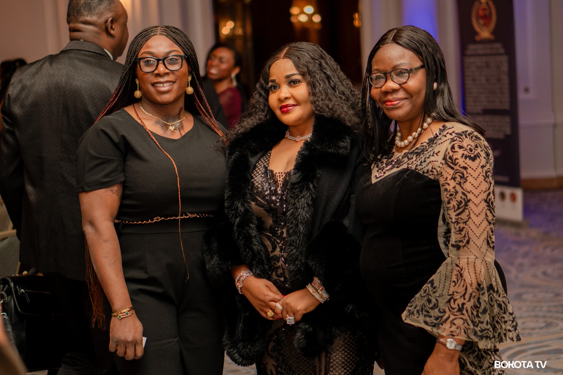 Three guests pose together during the gala reception